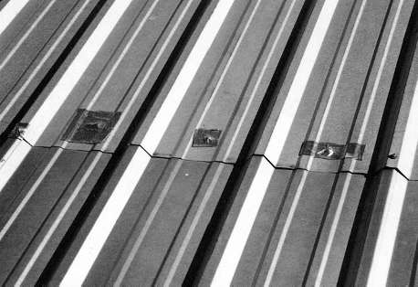 ALUMINUM QUICK PATCH is applied to seams and fastener heads 