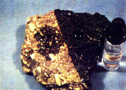 This photo  dramatically illustrates the rejuvenating penetrating and sealing qualities of QUICK-DRY ASPHALT PAVING SEAL.